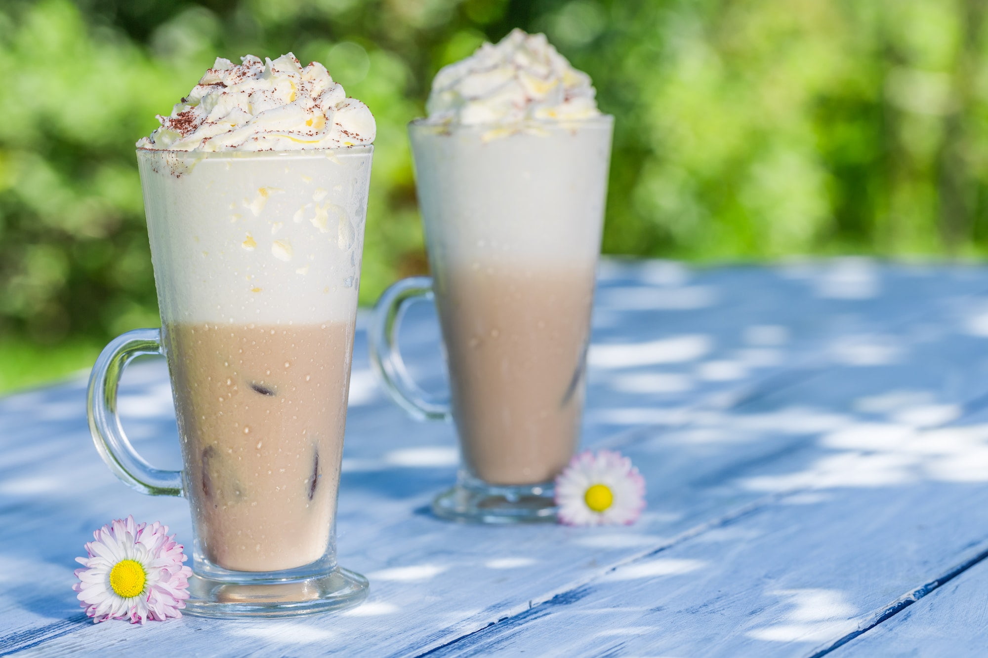 Cold coffee in summer in sunny garden